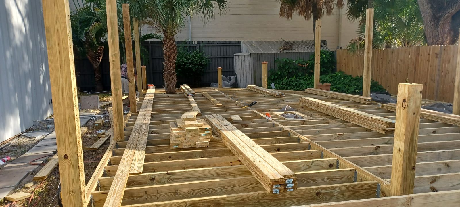 Completed pressure-treated joist layout ready for decking boards in Brevard County FL